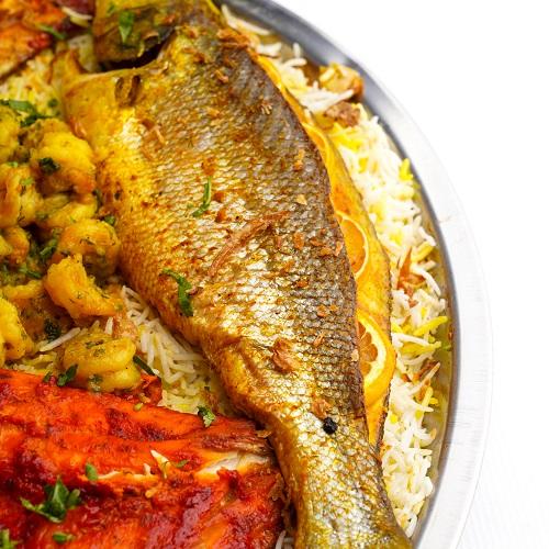 صينية سمك سيباس و روبيان مع عيش تكفى من 5الى7اشخاص
